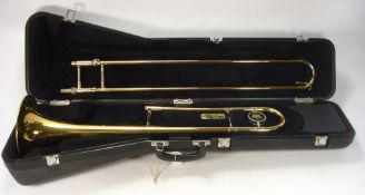 A 'King' 606 Brass Trombone in a fitted case:, together with two mouthpieces.