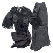 A Victorian black silk and embroidered lace jacket:, with batwing sleeves,