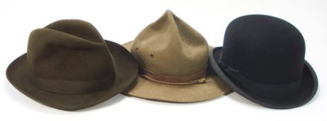 A black felt bowler hat by Dunn & Co, London:,