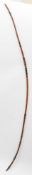 A late 19th century Japanese yumi (bow): of laminated bamboo, finished in red and black lacquer,