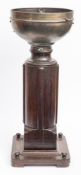 An early 20th century binnacle stand converted as a jardiniere:,