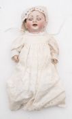 A German bisque headed doll by Hertsil & Schmit:, remains of brown wig , brown glass sleeping eyes,