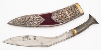 A kukri in a white metal mounted presentation scabbard:, of traditional form with horn handle,