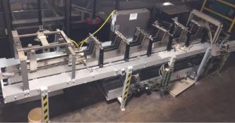 Climax Drop Case Packer with change parts – chutes, spacers and a U Shape powered roller conveyor to