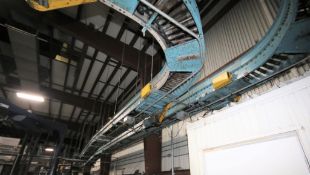 Approx. 25ft of Powered Roller/Belt Overhead Case Conveyor System from Packaging Room to Palletizers