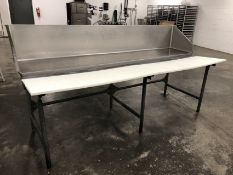S/S Butcher table with stainless steel back panel and plastic butcher blocks approximately 8’ Long