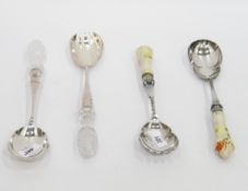 Two pairs of plated, ceramic and glass salad servers, three Jersey style milk jugs,