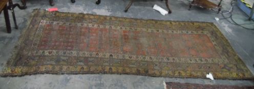 Eastern wool runner with stylised flowerhead trelliswork to the madder field, multiple borders,