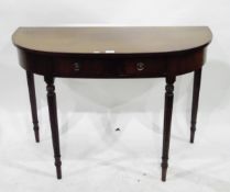 Reproduction mahogany side table of demi-lune form,