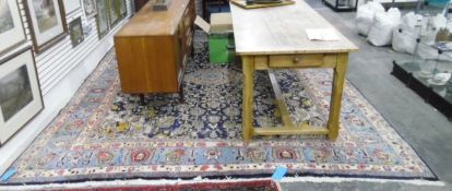 Large Mashad Persian carpet, the blue ground with central peach guls surrounded by foliate motifs,