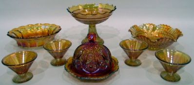 Marigold carnival glass comport, the bowl decorated with roses, on flared stem,