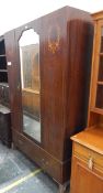 Edwardian mahogany wardrobe with inlaid decoration and central mirror door,