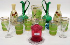 Pair of Victorian green glass jugs, each painted with white enamel lily of the valley (one cracked),