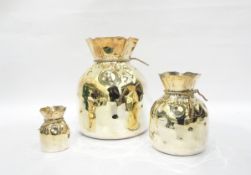Set of three Spanish silver plated graduated vases in the shape of rope tied sacks, 25.