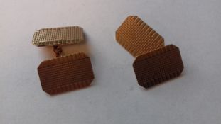 Pair of 9ct gold double-oblong cufflinks, engine-turned,