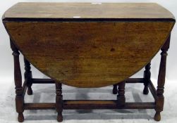 Old oak oval-top gateleg table with moulded edge, on turned baluster supports,