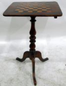 Victorian mahogany games table, the chequerboard top over a turned and tripod stand,