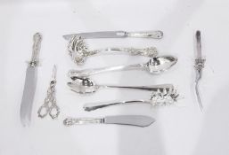 Silver plated handled carving knife and fork with ornate scroll handle,