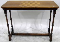Victorian walnut games table, the rectangular top with chequerboard inlay,