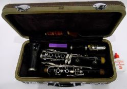 Clarinet within its original case, with cleaner, marked 'Boosey & Hawkes,