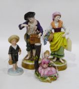 Pair of continental male and female figures of flower seller and gentleman with bird and two other