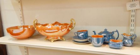 Carltonware tete-a-tete, blue ground with orange lustre to inside,