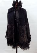 Black wool Victorian cloak, heavily embroidered with ribbon detail,