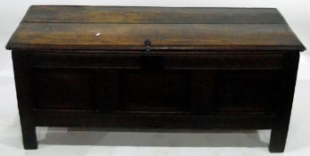 Early 18th century oak coffer with a three-panelled carved front and similarly carved two-panelled