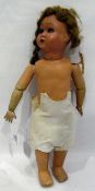 Bisque headed doll with composition body, open eyes and mouth, unmarked back of head,