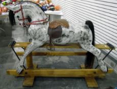 Dapple grey rocking horse, with horse hair mane and tail, mounted on a pine twin-pedestal support,