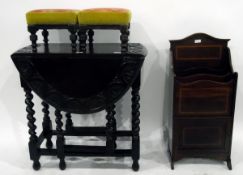 Oak drop-leaf table with carved top, on spiral twist supports united by stretchers,