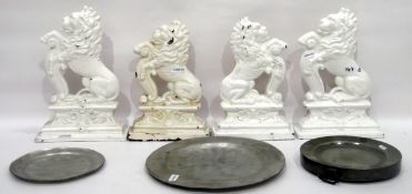 Pair of 19th century cast iron door stops, lions rampant, painted white and two others,