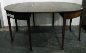 Mahogany D-end dining table on tapering supports and castors