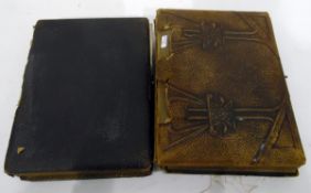Two Victorian photograph albums containing portrait photographs and several postcards