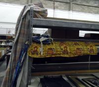 Assorted curtains of coloured check fabric and a blind decorated with elephants and camels