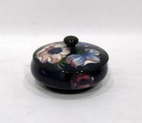Moorcroft pottery 'Anemone' pattern lidded powder pot in blue and purple,