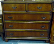 Reproduction straight-front chest of two short and three long drawer, with brass bale handles,