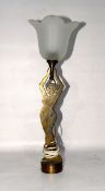 1920s brass-finish metal table lamp modelled as a two-dimensional nude female supporting a glass