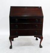 Mahogany bureau with fall-front enclosing pigeonholes above three drawers,
