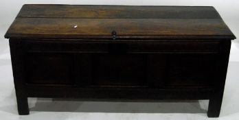 Early 18th century oak coffer with a three-panelled carved front and similarly carved two-panelled