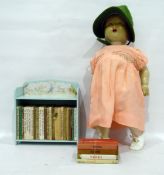 Various Beatrix Potter books on The Peter Rabbit's bookshelf,