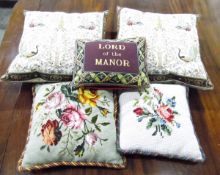 Two tapestry and velvet cushions with braid edges,