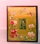 Large red leather gilt tooled photograph frame with embroidered and silk applique flowers,