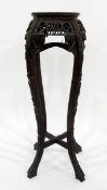 Chinese carved hardwood jardiniere stand with pink marble inset top,