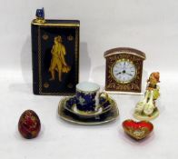 Royal Doulton ceramic mantel clock, Hummel figure, modern Faberge red glass egg,