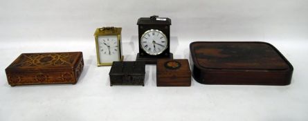 Metamec quartz 20th century mantel clock, a modern desk clock, a carved wooden jewellery box,