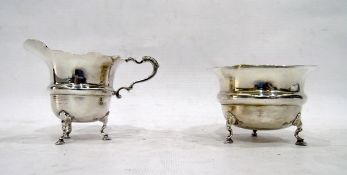 Early 20th century silver sugar bowl and milk jug, with frill rim, circular body with raised ring,