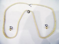 Cultured pearl graduated necklace on silver clasp and a pair of earrings