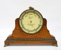 Circular brass travelling barometer marked F.