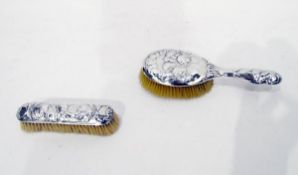 Edward VII silver handled brush and rectangular brush, with relief decoration of cherubs,